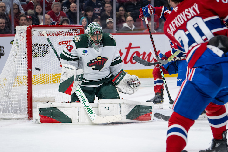 MONTREAL, QC - JANUARY 30: Juraj Slafkovsky (20) of the Montreal Canadiens shoots the puck and hits the post right of Marc-Andre Fleury (29) of the Minnesota Wild during the second period of the NHL game between the Minnesota Wilds and the Montreal Canadiens on Jan 30 2025, at the Bell Centre in Montreal, QC(Photo by Vincent Ethier/Icon Sportswire)